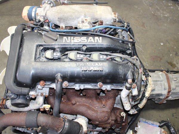 jdm-1995-1998-nissan-240sx-s14-motor-5-speed-sr20det-20l-4-cyl-engine.jpg JDM 1995-1998 Nissan 240SX S14 Motor 5 Speed SR20DET 2.0L 4 Cyl Engine - Image 1